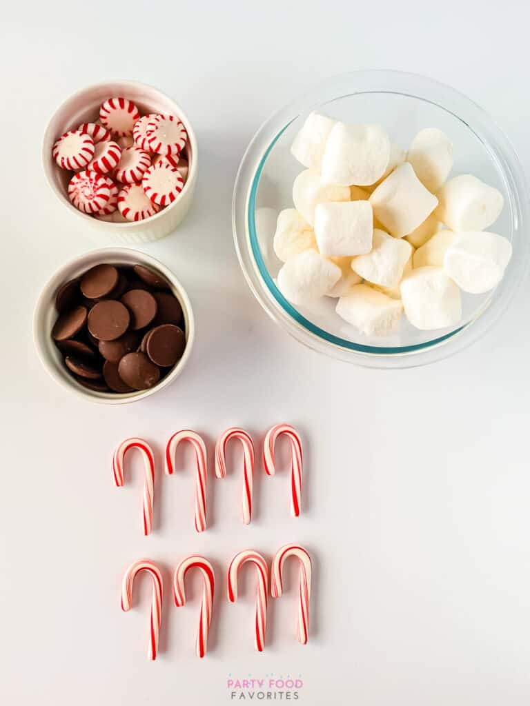 ingredients needed to make hot chocolate stir sticks out of candy canes: candy canes, chocolate melts, peppermints, and marshmallows