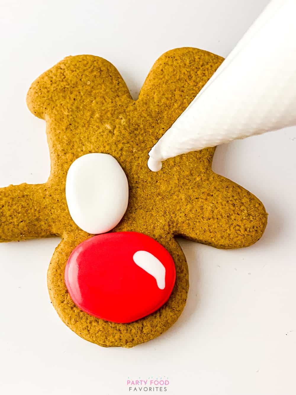 drawing eyes on reindeer cookies