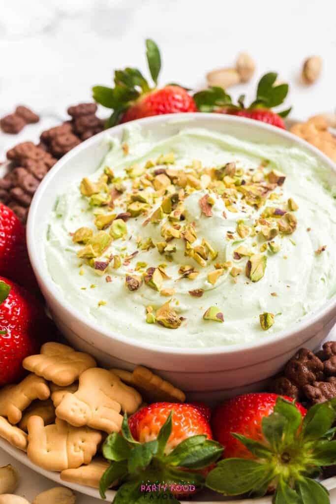 pistachio dessert dip with strawberries and animal crackers