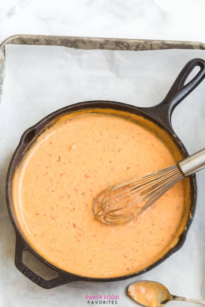 whisking arrowroot powder into a cheese dip