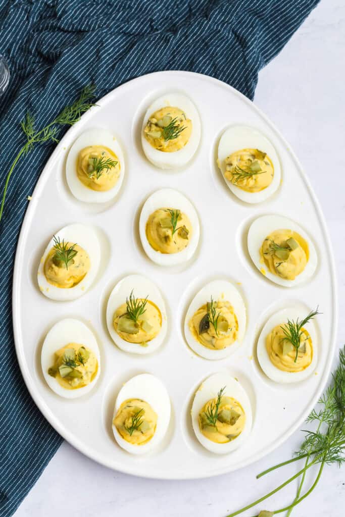 a deviled egg platter filled with stuffed eggs