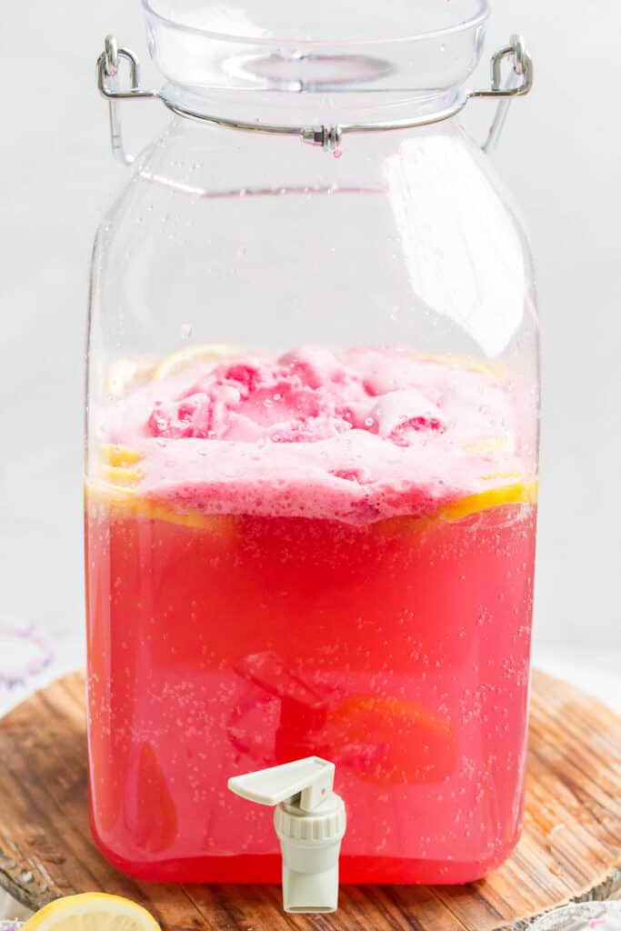 pink party punch in a drink dispenser