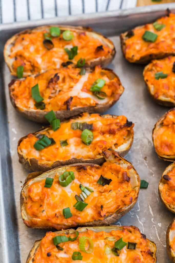spicy potato skins with green inions and melted cheese