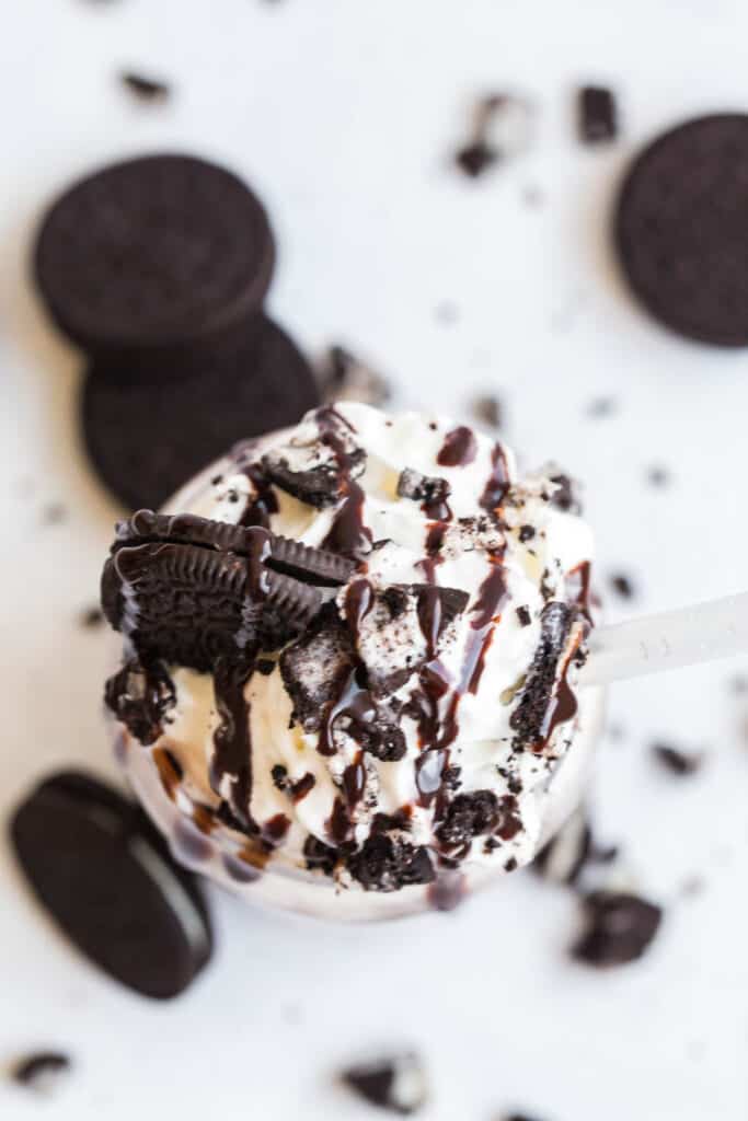 whipped cream topped with chocolate syrup and oreos