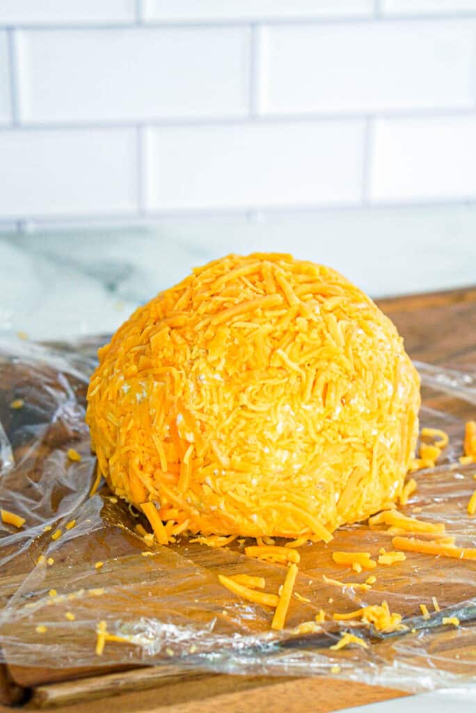 cheddar cheese pressed into a cheeseball