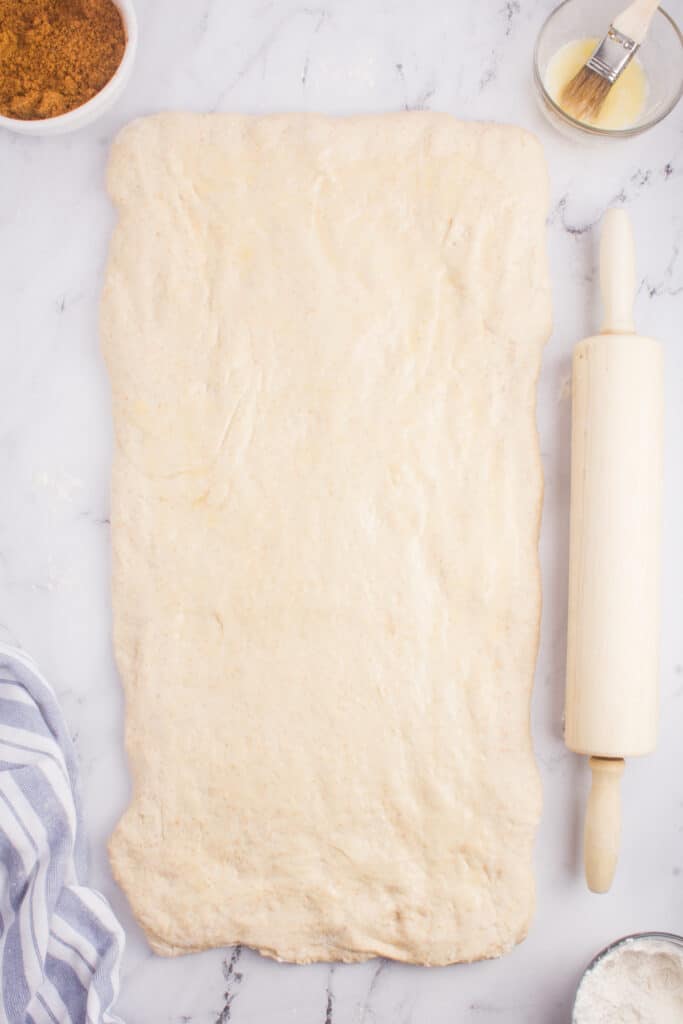 roll the cinnamon roll dough into a large rectangle